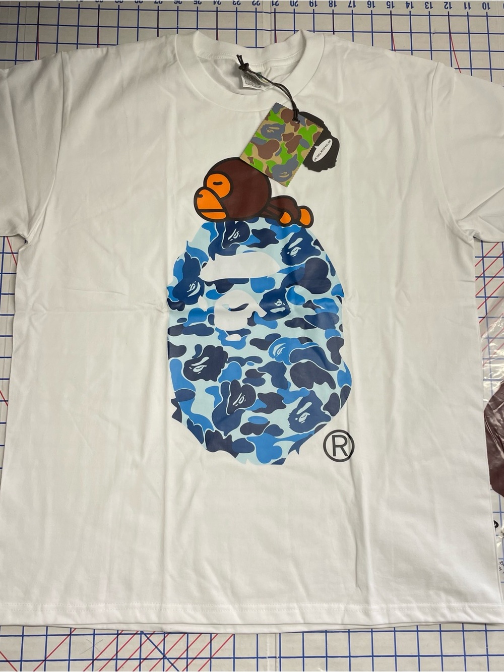 White Short-Sleeve Tee with Blue Camo Ape Head Graphic